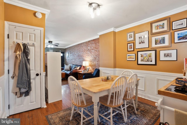 2326 E Boston St, Philadelphia, PA 19125 - dining area with crown molding, wood finished floors, ceiling fan, and a wainscoted wall