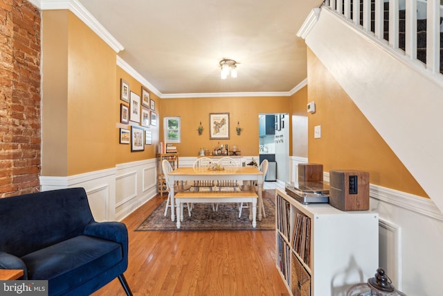 2326 E Boston St, Philadelphia, PA 19125 - dining space featuring wood finished floors, wainscoting, and ornamental molding