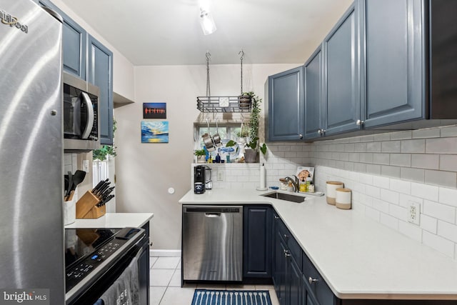2326 E Boston St, Philadelphia, PA 19125 - kitchen with stainless steel appliances, blue cabinets, and backsplash