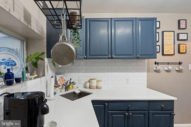 2326 E Boston St, Philadelphia, PA 19125 - kitchen with blue cabinets, a sink, and decorative backsplash