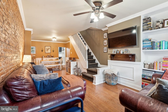 2326 E Boston St, Philadelphia, PA 19125 - living room featuring stairway, ceiling fan, wood finished floors, crown molding, and built in shelves