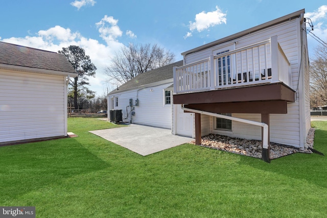 8505 Rosemont Cir, Alexandria, VA 22309 - rear view of property with a patio area, a lawn, and central AC