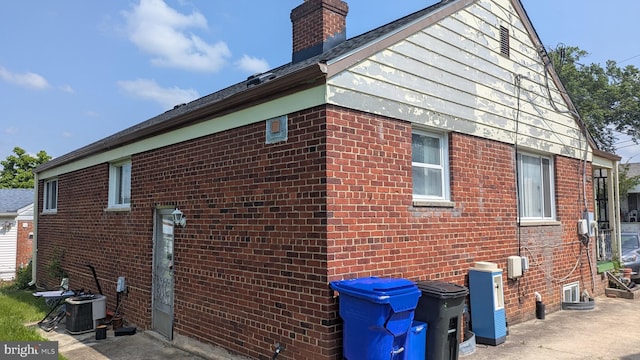 1611 Parham Rd, Silver Spring, MD 20903 - view of home's exterior with a chimney and brick siding
