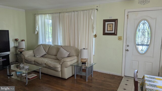 1611 Parham Rd, Silver Spring, MD 20903 - living room with crown molding, wood finished floors, and baseboards