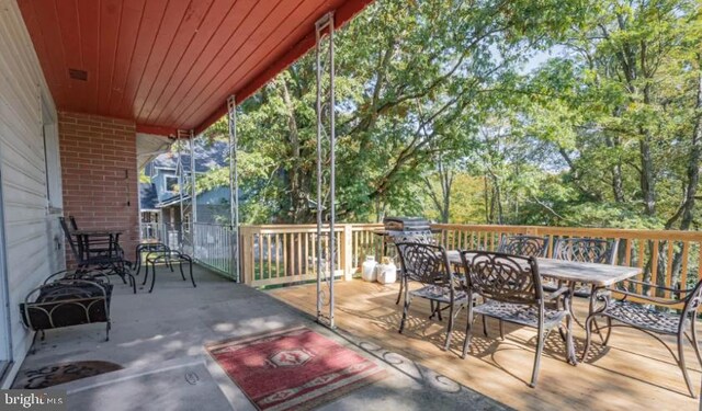 1417 Marsh Hill Rd, Mc Henry, MD 21541 - view of patio / terrace with outdoor dining space and view of wooded area