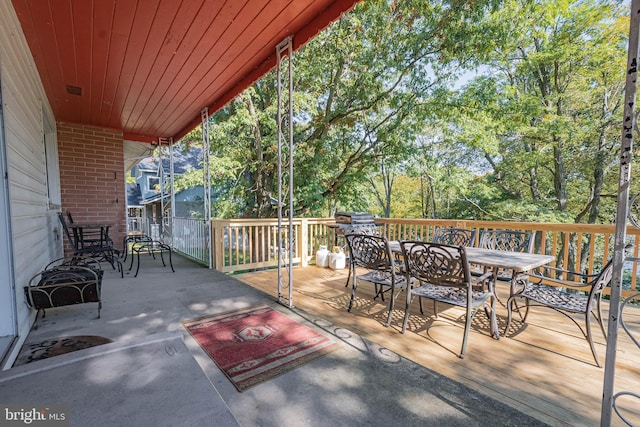 1417 Marsh Hill Rd, Mc Henry, MD 21541 - wooden terrace with outdoor dining area and view of wooded area