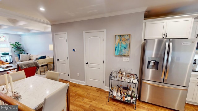 2714 Fait Ave, Baltimore, MD 21224 - kitchen with stainless steel refrigerator with ice dispenser, light wood finished floors, ornamental molding, white cabinetry, and recessed lighting