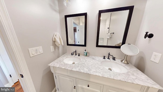 2714 Fait Ave, Baltimore, MD 21224 - full bathroom featuring double vanity and wood finished floors