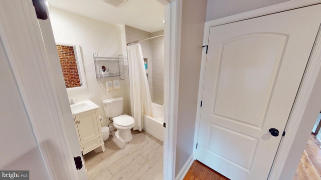 2714 Fait Ave, Baltimore, MD 21224 - bathroom with toilet, vanity, wood finished floors, and shower / tub combo