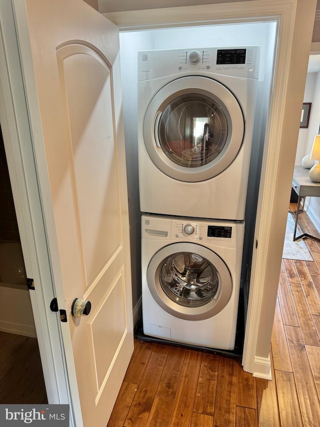 2714 Fait Ave, Baltimore, MD 21224 - laundry area with estacked washer and dryer and wood finished floors
