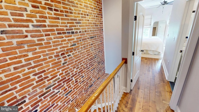 2714 Fait Ave, Baltimore, MD 21224 - corridor featuring brick wall, hardwood / wood-style floors, arched walkways, and baseboards