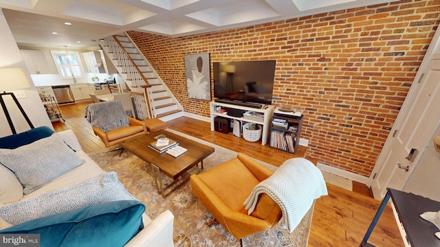 2714 Fait Ave, Baltimore, MD 21224 - living room featuring brick wall, hardwood / wood-style floors, stairway, coffered ceiling, and beamed ceiling