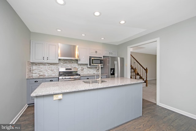 13 Briarcliff Rd, Marlton, NJ 08053 - kitchen featuring appliances with stainless steel finishes, wall chimney range hood, a sink, dark wood finished floors, and baseboards