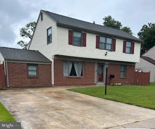 13 Briarcliff Rd, Marlton, NJ 08053 - view of front facade with a front lawn, brick siding, and concrete driveway