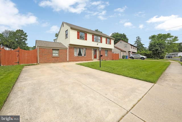 13 Briarcliff Rd, Marlton, NJ 08053 - colonial inspired home with concrete driveway, brick siding, and a gate