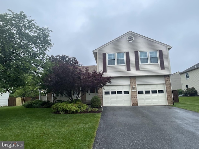 17220 Larosa Dr, Rockville, MD 20855 - view of front facade featuring driveway, brick siding, and a garage