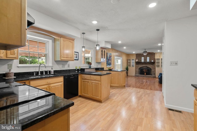 17220 Larosa Dr, Rockville, MD 20855 - kitchen featuring black dishwasher, a sink, a peninsula, open floor plan, and light wood-style flooring