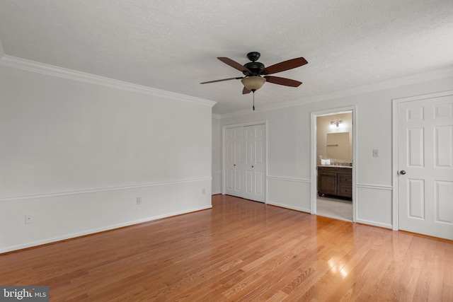 17220 Larosa Dr, Rockville, MD 20855 - unfurnished bedroom featuring light wood-type flooring, ornamental molding, connected bathroom, a textured ceiling, and ceiling fan
