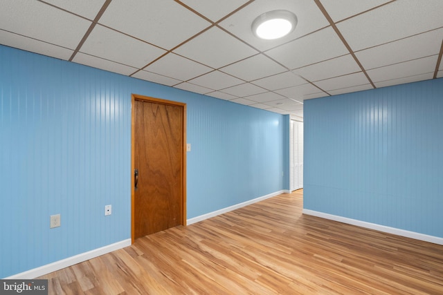 17220 Larosa Dr, Rockville, MD 20855 - empty room with a drop ceiling, wood finished floors, and baseboards