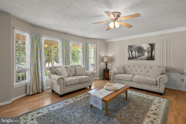 17220 Larosa Dr, Rockville, MD 20855 - living area featuring a textured ceiling, ceiling fan, wood finished floors, and crown molding
