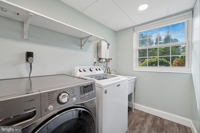 26 Anvil Rd, Aston, PA 19014 - laundry area featuring independent washer and dryer, wood finished floors, baseboards, and water heater