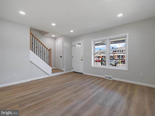 7907 Wallace Rd, Dundalk, MD 21222 - foyer featuring recessed lighting, wood finished floors, baseboards, and stairway