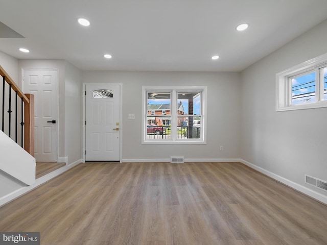 7907 Wallace Rd, Dundalk, MD 21222 - foyer with light wood-style flooring, baseboards, recessed lighting, and stairway