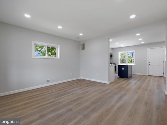 7907 Wallace Rd, Dundalk, MD 21222 - unfurnished living room featuring recessed lighting, baseboards, and light wood-style floors