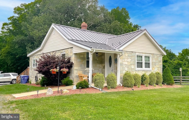 6165 Hawthorne Rd, La Plata, MD 20646 - view of front of property featuring a standing seam roof, a chimney, stone siding, and metal roof