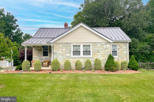 6165 Hawthorne Rd, La Plata, MD 20646 - view of front of property with a standing seam roof, stone siding, metal roof, and a chimney