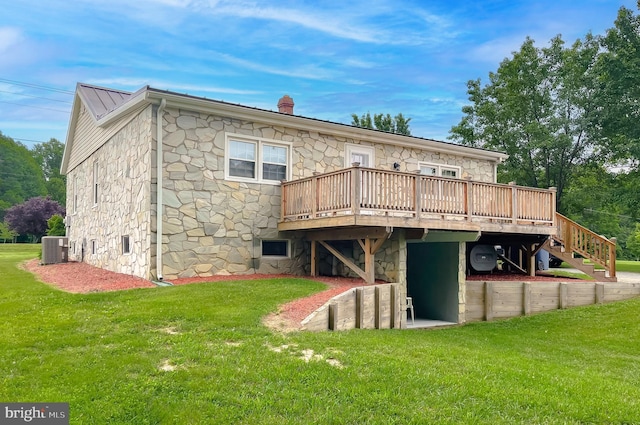 6165 Hawthorne Rd, La Plata, MD 20646 - rear view of property with stone siding, a yard, a deck, central AC unit, and a chimney