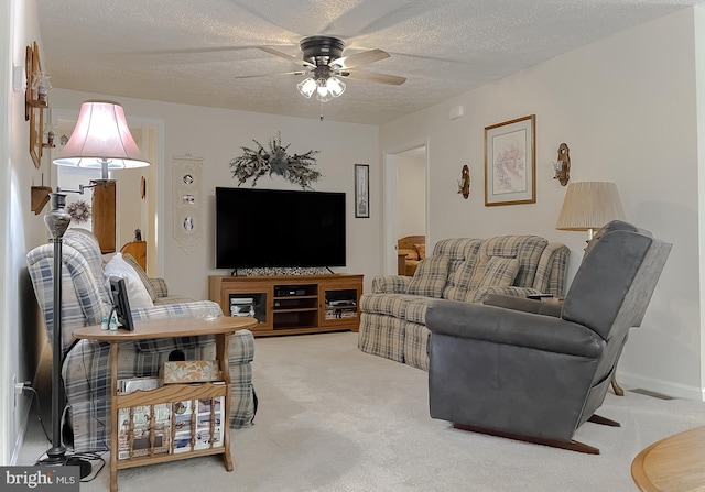 6165 Hawthorne Rd, La Plata, MD 20646 - carpeted living room with a ceiling fan and a textured ceiling