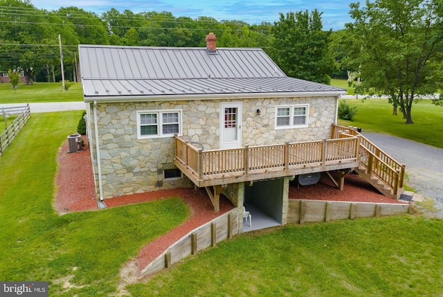 6165 Hawthorne Rd, La Plata, MD 20646 - back of property with stone siding, a deck, a lawn, and central AC unit