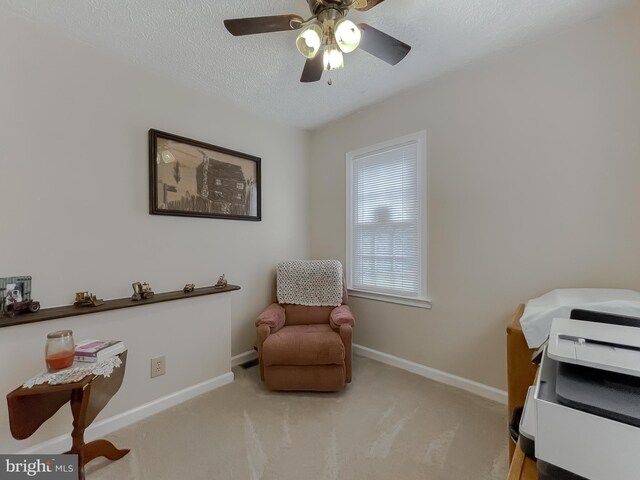 6165 Hawthorne Rd, La Plata, MD 20646 - living area with carpet, baseboards, a textured ceiling, and a ceiling fan