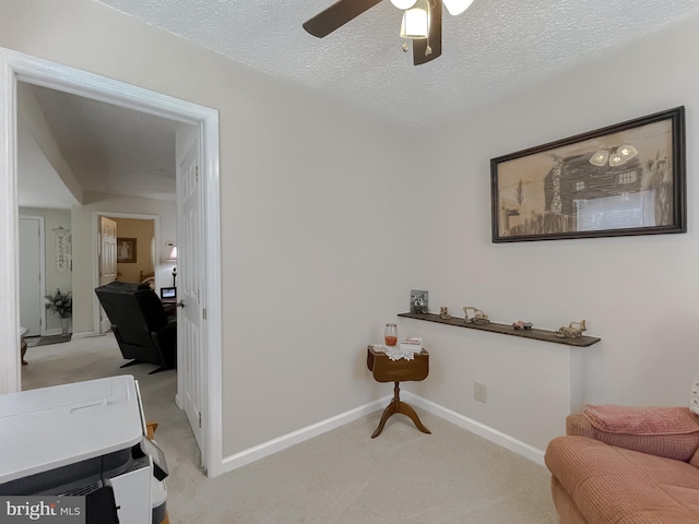 6165 Hawthorne Rd, La Plata, MD 20646 - living area featuring light colored carpet, a ceiling fan, a textured ceiling, and baseboards