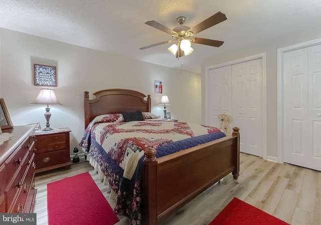 6165 Hawthorne Rd, La Plata, MD 20646 - bedroom featuring light wood finished floors, two closets, and ceiling fan