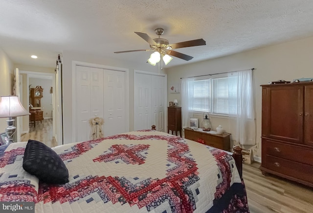 6165 Hawthorne Rd, La Plata, MD 20646 - bedroom with two closets, light wood-style floors, a ceiling fan, recessed lighting, and baseboards