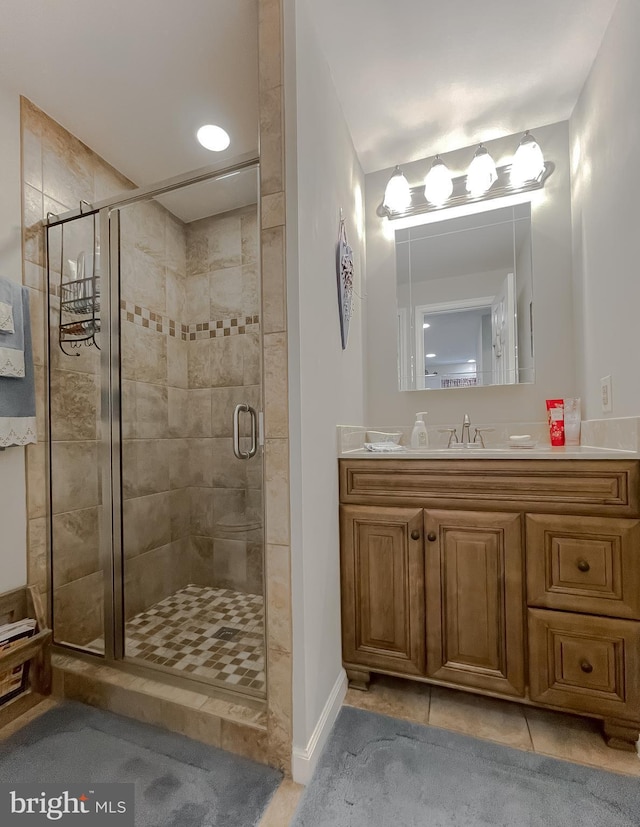 6165 Hawthorne Rd, La Plata, MD 20646 - bathroom featuring a stall shower, vanity, and tile patterned floors