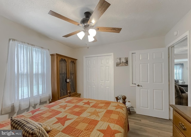 6165 Hawthorne Rd, La Plata, MD 20646 - bedroom featuring a closet, wood finished floors, ceiling fan, and a textured ceiling