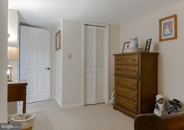 6165 Hawthorne Rd, La Plata, MD 20646 - bedroom with a closet, light carpet, and baseboards