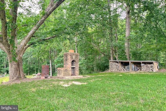 6165 Hawthorne Rd, La Plata, MD 20646 - view of grassy yard with an outdoor brick fireplace