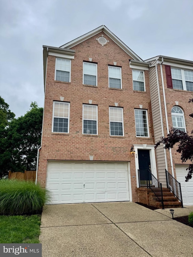 84 Two Rivers Dr, Edgewater, MD 21037 - view of front of property featuring a garage, brick siding, and driveway
