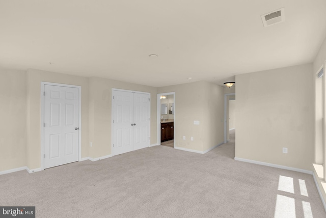 538 Copley Pl Unit 1-A, Gaithersburg, MD 20878 - unfurnished bedroom with light carpet, ensuite bathroom, and a closet