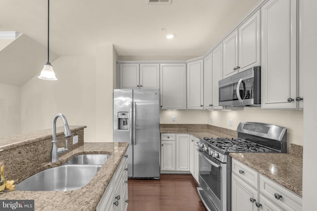 538 Copley Pl Unit 1-A, Gaithersburg, MD 20878 - kitchen with stainless steel appliances, hanging light fixtures, light stone counters, dark wood finished floors, and recessed lighting