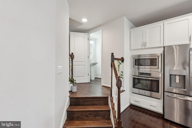 42533 Benfold Sq, Brambleton, VA 20148 - kitchen featuring stainless steel appliances, dark wood-type flooring, white cabinetry, baseboards, and recessed lighting