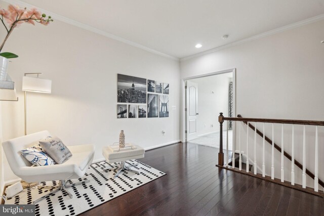 42533 Benfold Sq, Brambleton, VA 20148 - living area featuring crown molding, wood finished floors, recessed lighting, an upstairs landing, and baseboards