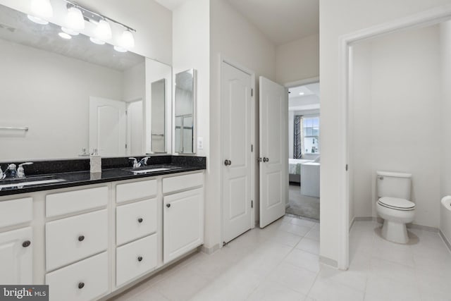 42533 Benfold Sq, Brambleton, VA 20148 - bathroom with double vanity, toilet, ensuite bathroom, and tile patterned floors