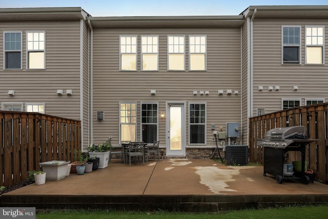 42533 Benfold Sq, Brambleton, VA 20148 - rear view of house with a patio area, central AC unit, and a fenced backyard