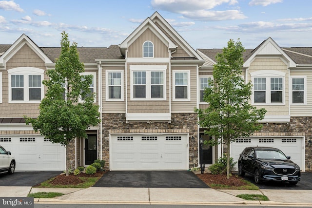 42533 Benfold Sq, Brambleton, VA 20148 - view of property featuring stone siding and driveway