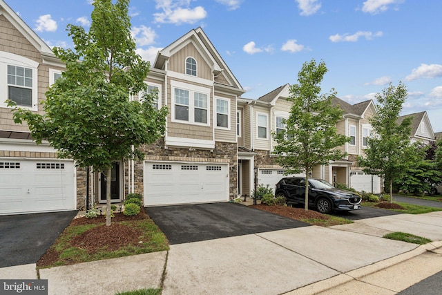 42533 Benfold Sq, Brambleton, VA 20148 - view of property featuring stone siding, asphalt driveway, and board and batten siding